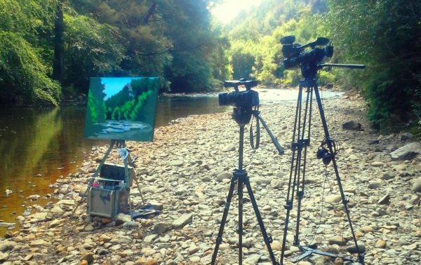 Painting DVD shoot day 1 shows a half painted canvas alongside the Avoca River.