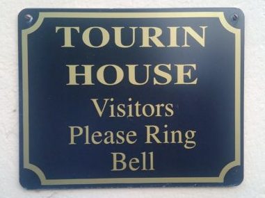 Tourin door sign.