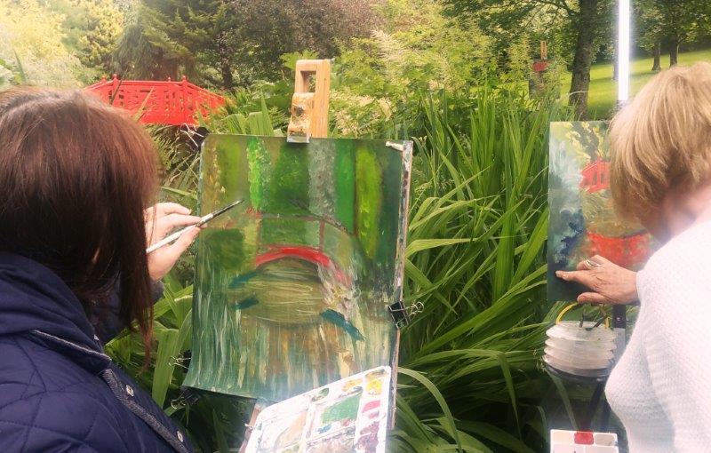 The bridge splashes red in to a see of green at last summer's Knocknaree Painting Workshop.