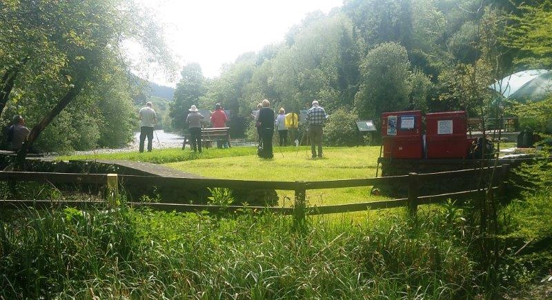 Students work in the sunshine at the Meetings Painting Workshop last June.