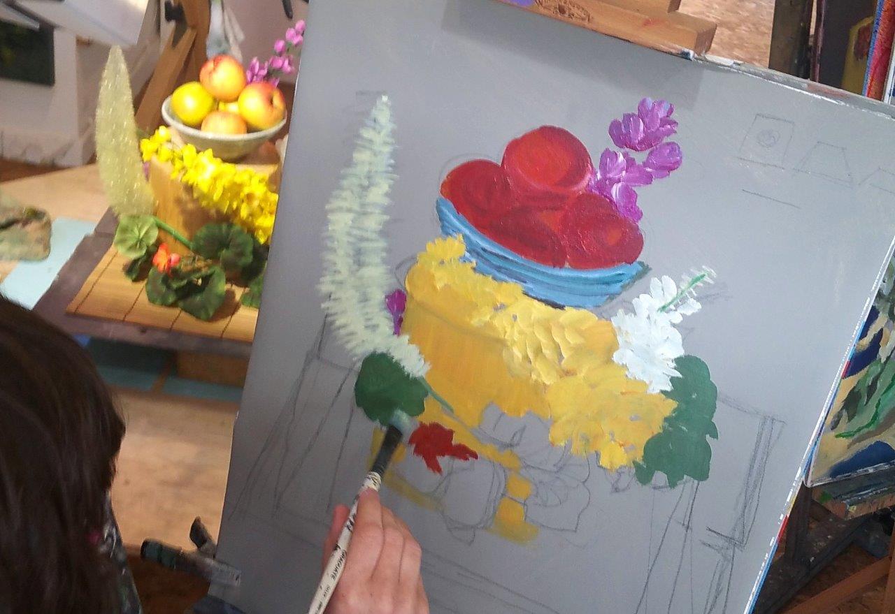 Painting a riot of colour in the studio.