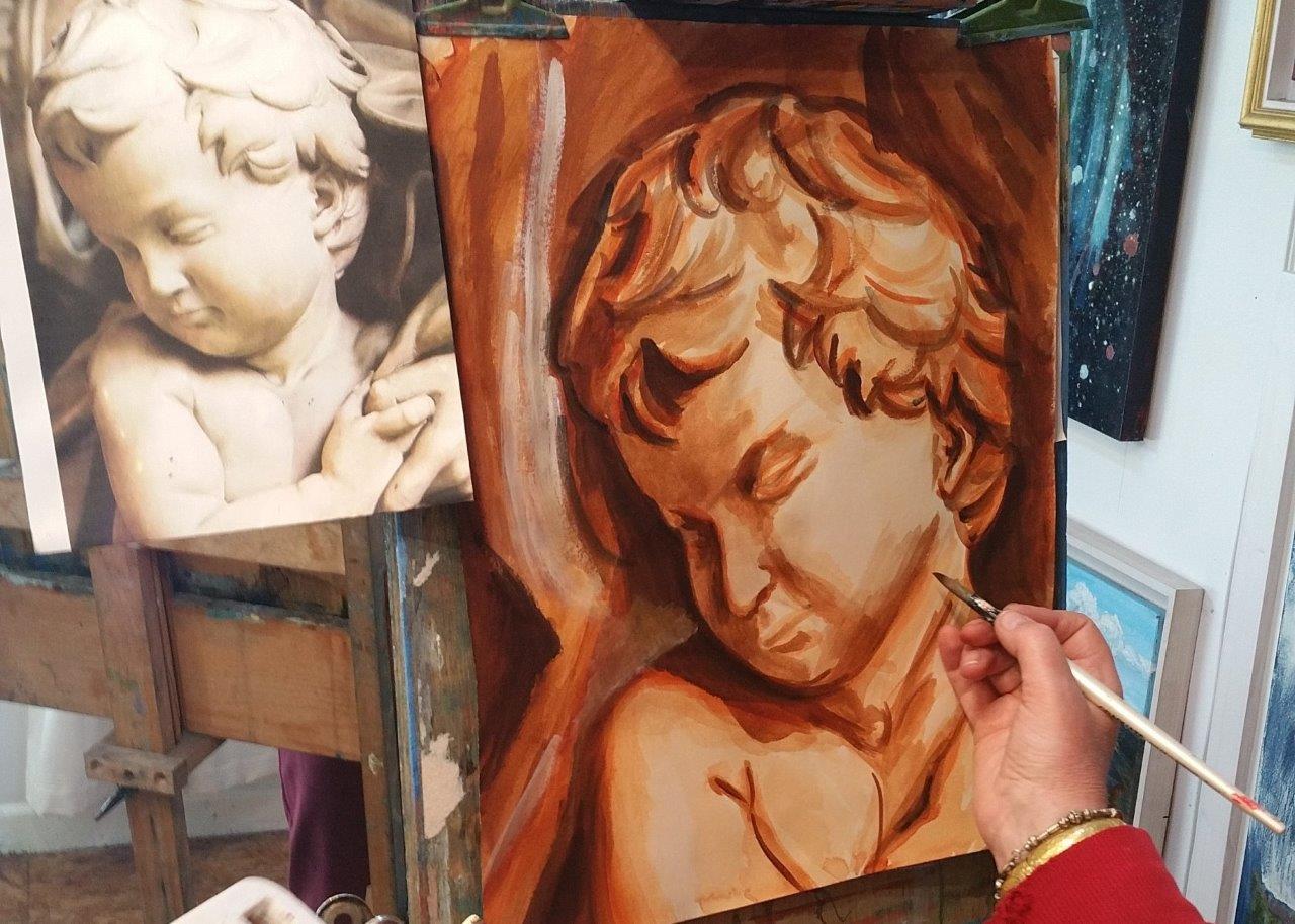 Art student paints cupid in raw sienna. Autumn Painting Course.