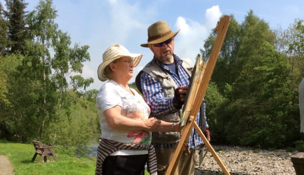 Rod Coyne explaining painting techniques for working outdoors.