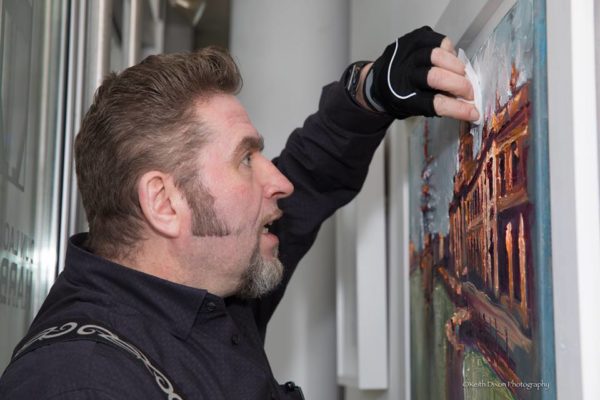 A frantic repair job at Dublin Docklands by Rod Coyne to save his painting "Masts at Customhouse" at the eleventh hour. 