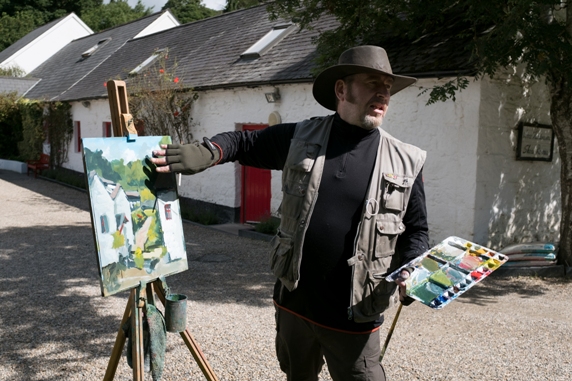 Rod Coyne explains techniques through painting demonstration.