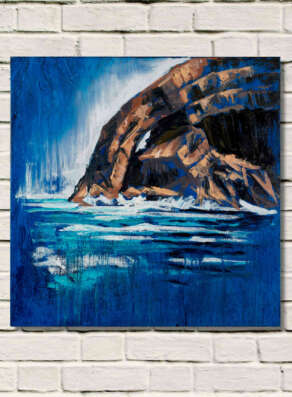 artist rod coyne's painting " Skellig Arch " displayed on a white brick wall.