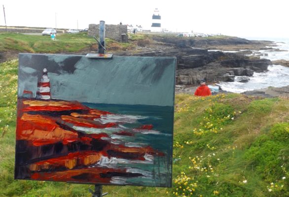 Hookhead Lighthouse in the distance while a very red version of same stands on the easel.