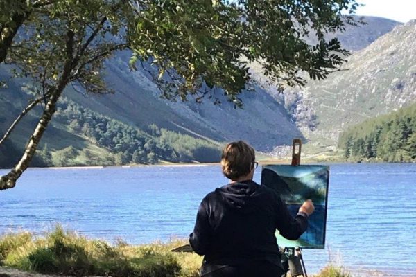 Photo dpicting a student makes the finishing touches at the end of a successful day's work from our Painting Workshop at Glendalough in 2019.