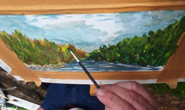 Photo of a student working in water colour during our August Painting Workshop in 2019.