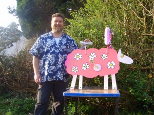Artist Rod Coyne pictured with his creation Daisy the bicycle sheep.