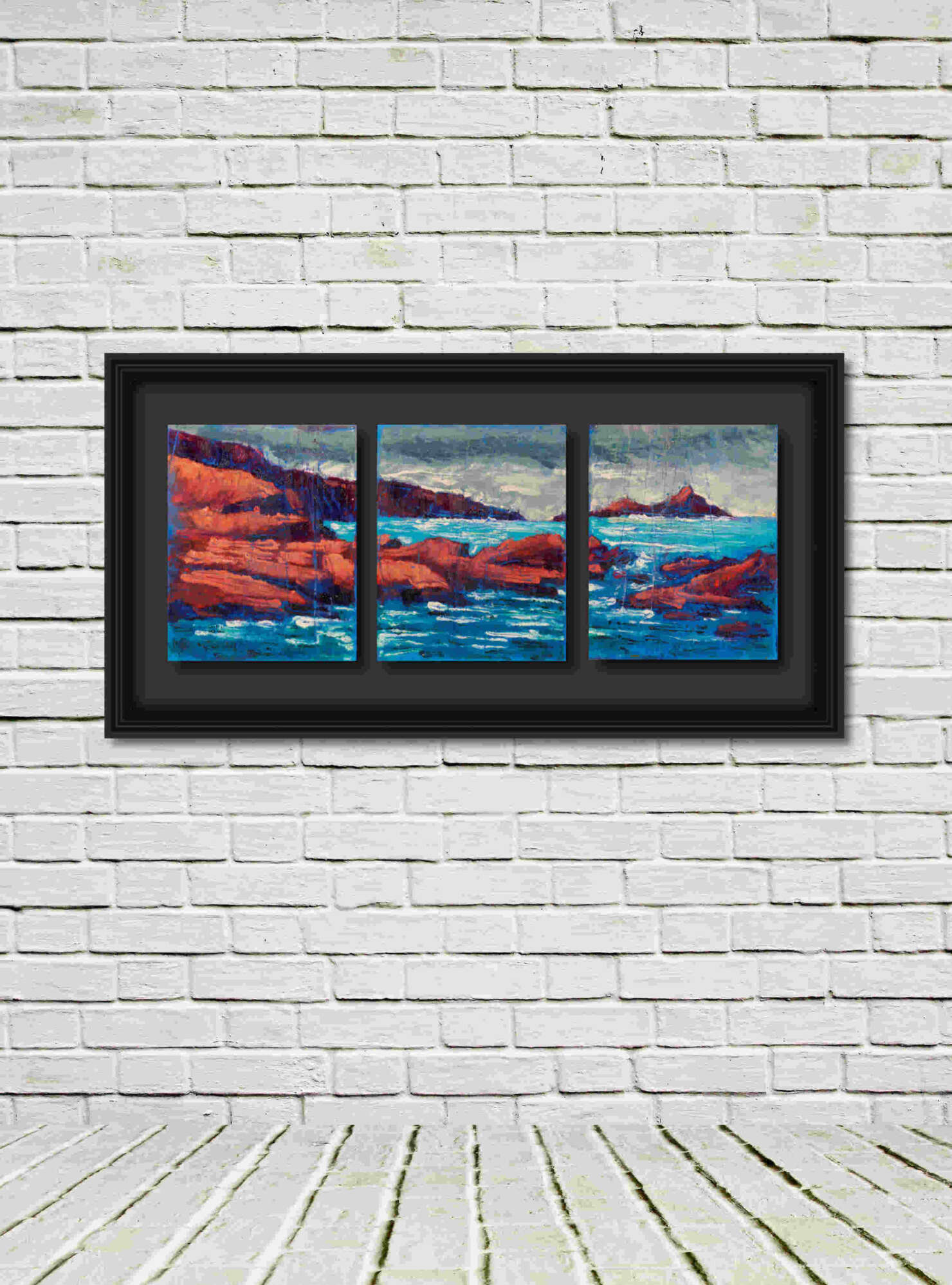 Artist Rod Coyne's triptych "Puffin Sound" is shown here, black framed triptych in a white room.