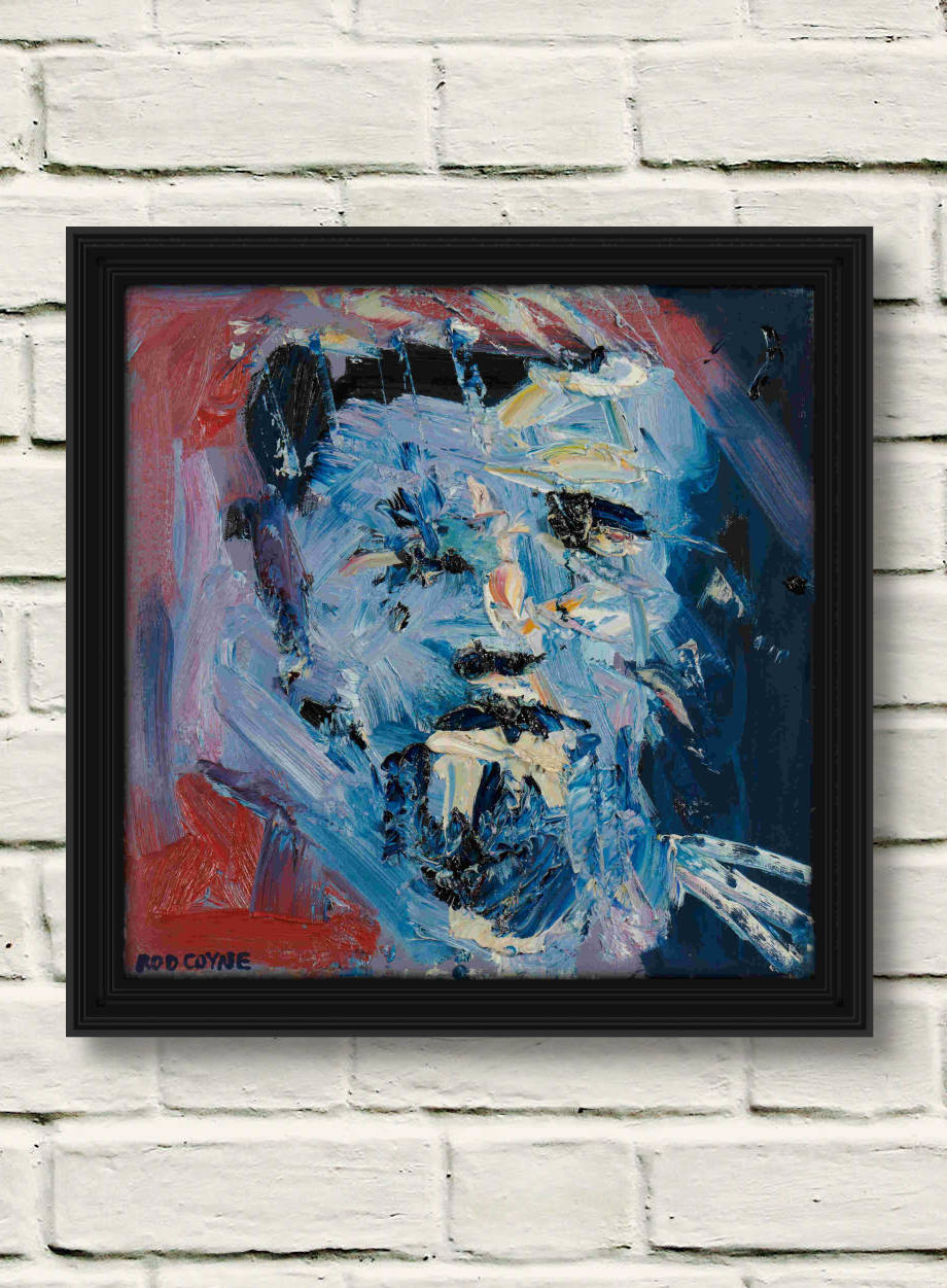 artist rod coyne's portrait Blaue Kunstler" is shown here framed on a white brick wall.