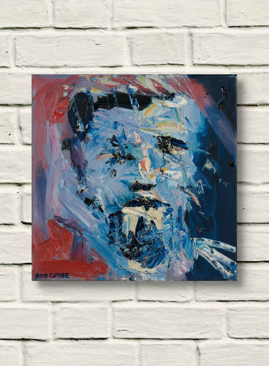 artist rod coyne's portrait Blaue Kunstler" is shown here unframed on a white brick wall.