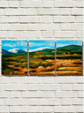 artist rod coyne's triptych painting "lugnaquilla from aughavana" is shown here on a white brick wall.