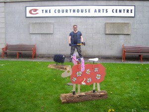artist rod coyne, outside the courthouse arts centre, tinahely, installing his new artwork "daisey"